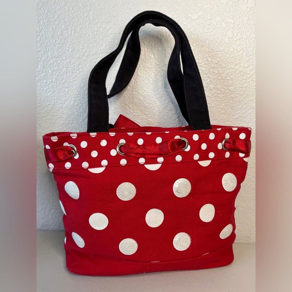 Bolso de mano de Minnie Mouse de Disney. Rojo con correas negras, lunares y cinta roja.