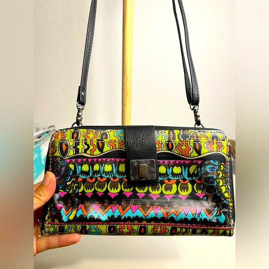 Bolsos y carteras tipo bandolera Sakroots con exterior de lona para mujer