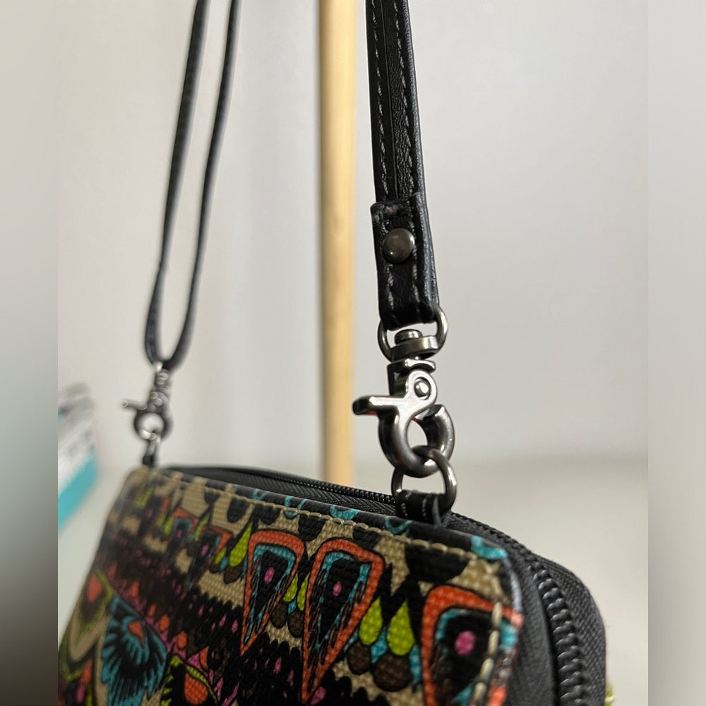 Bolsos y carteras tipo bandolera Sakroots con exterior de lona para mujer