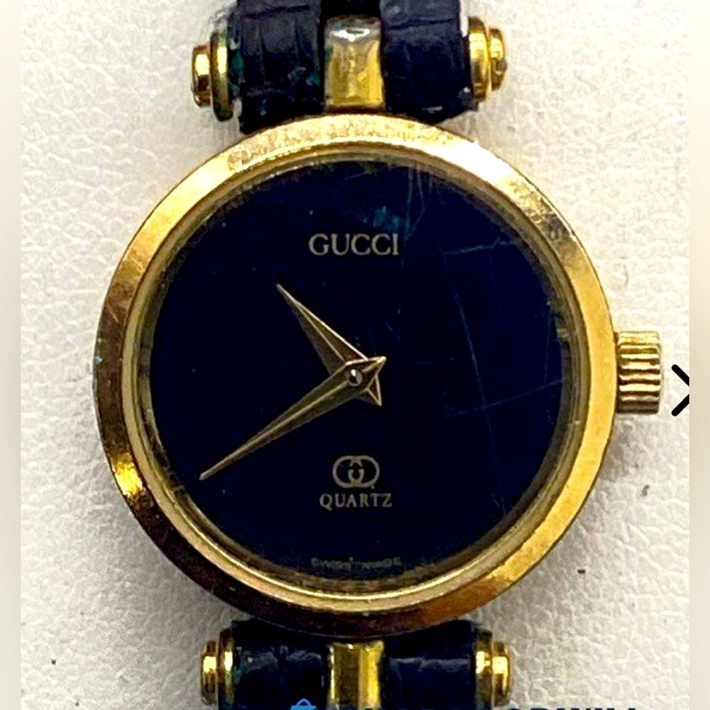 Vintage Gucci Gold Black Tone Watch with Leather Strap.