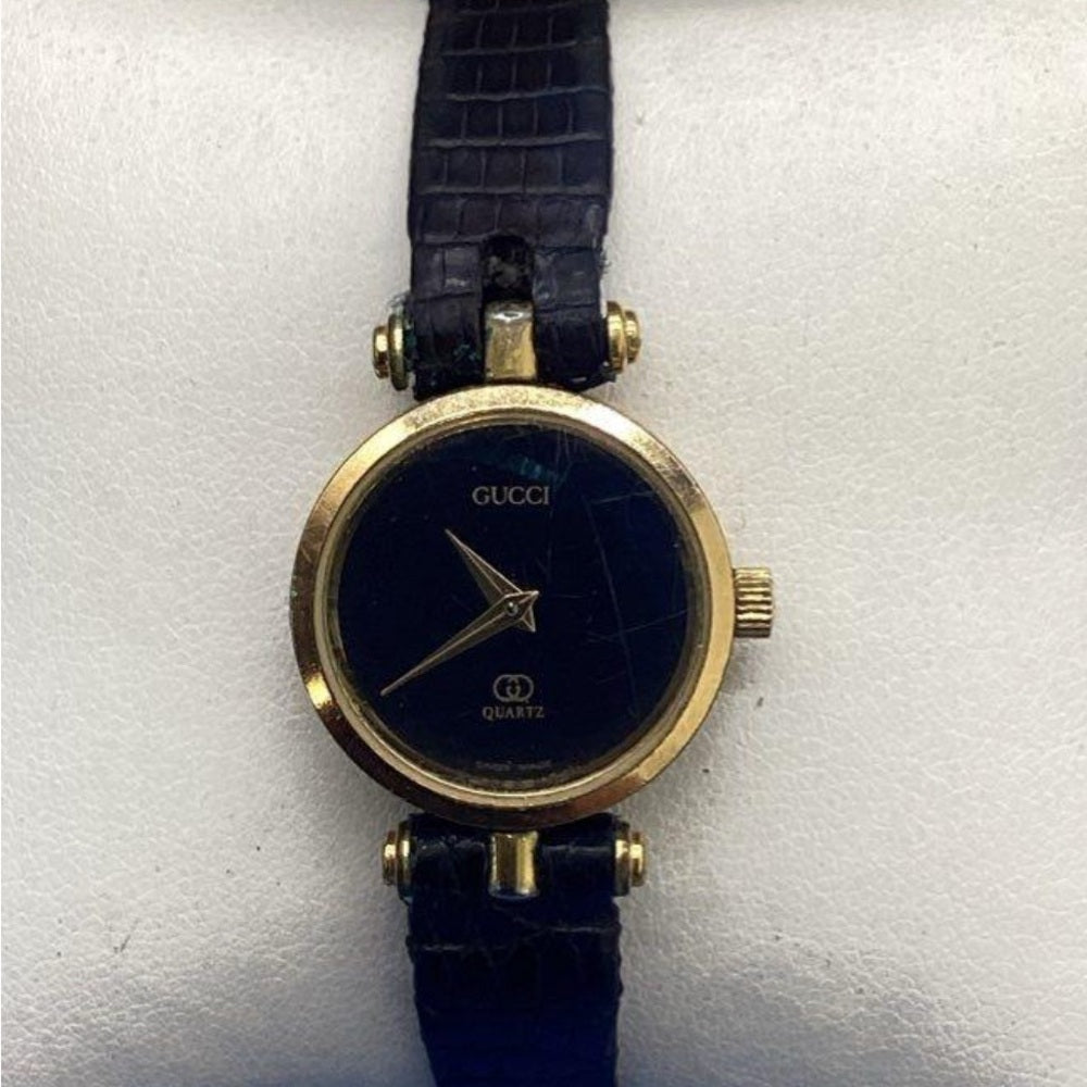 Vintage Gucci Gold Black Tone Watch with Leather Strap.