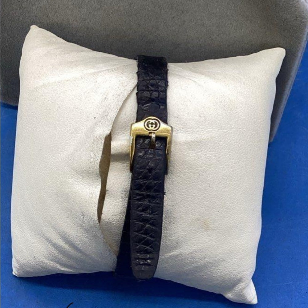 Vintage Gucci Gold Black Tone Watch with Leather Strap.