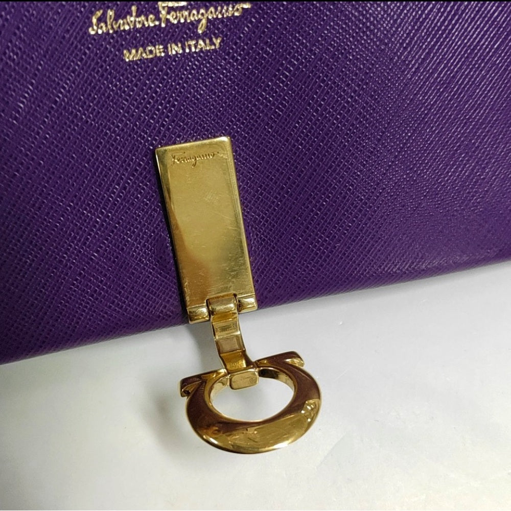 SALVATORE FERRAGAMO
Grape Saffiano Leather Gancini Icona Wallet