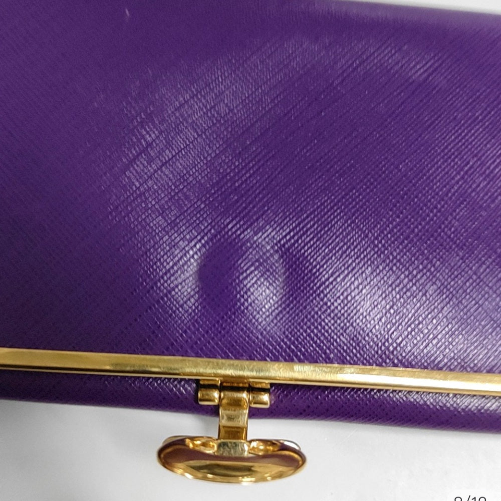 SALVATORE FERRAGAMO
Grape Saffiano Leather Gancini Icona Wallet