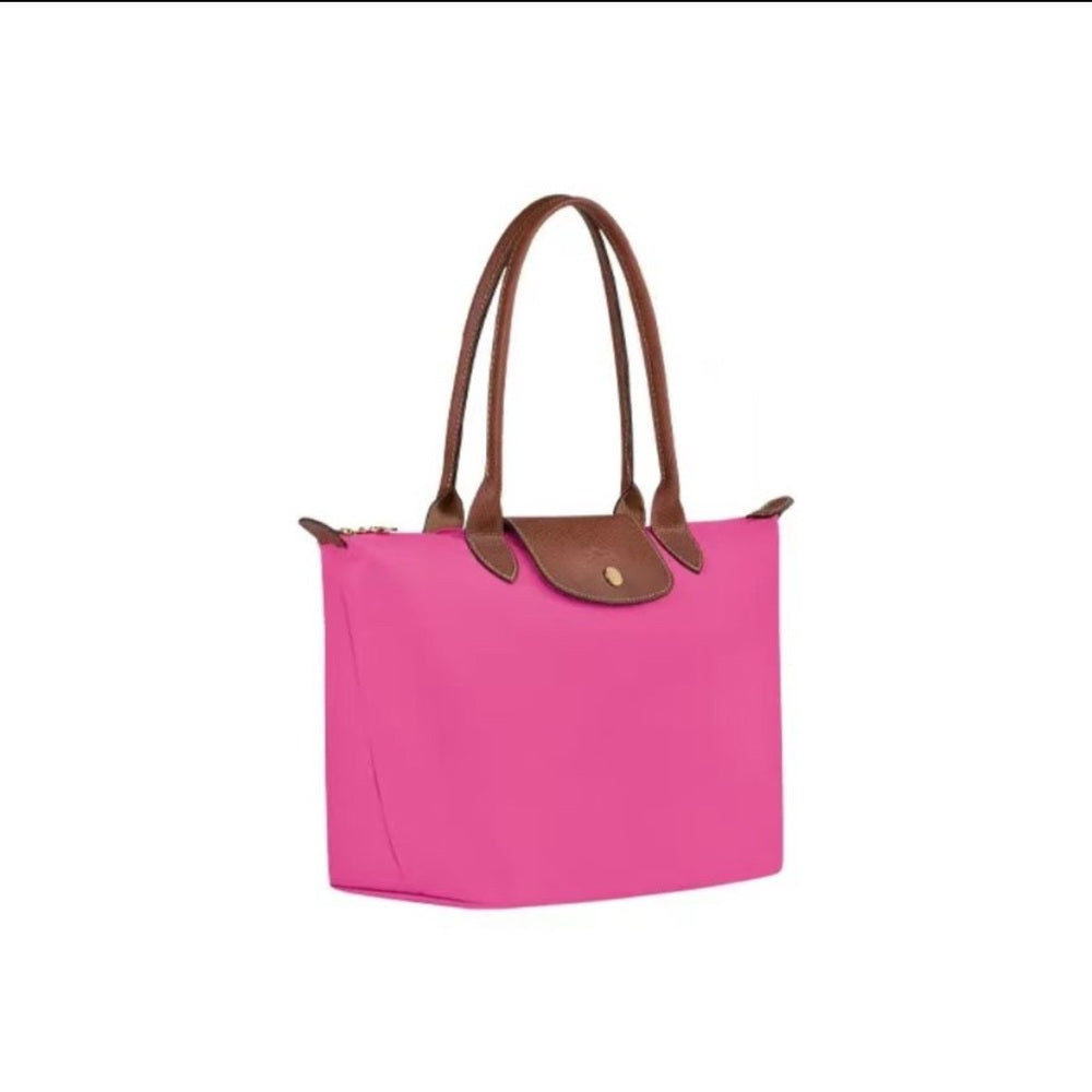 Bolso de mano rosa con detalles marrones