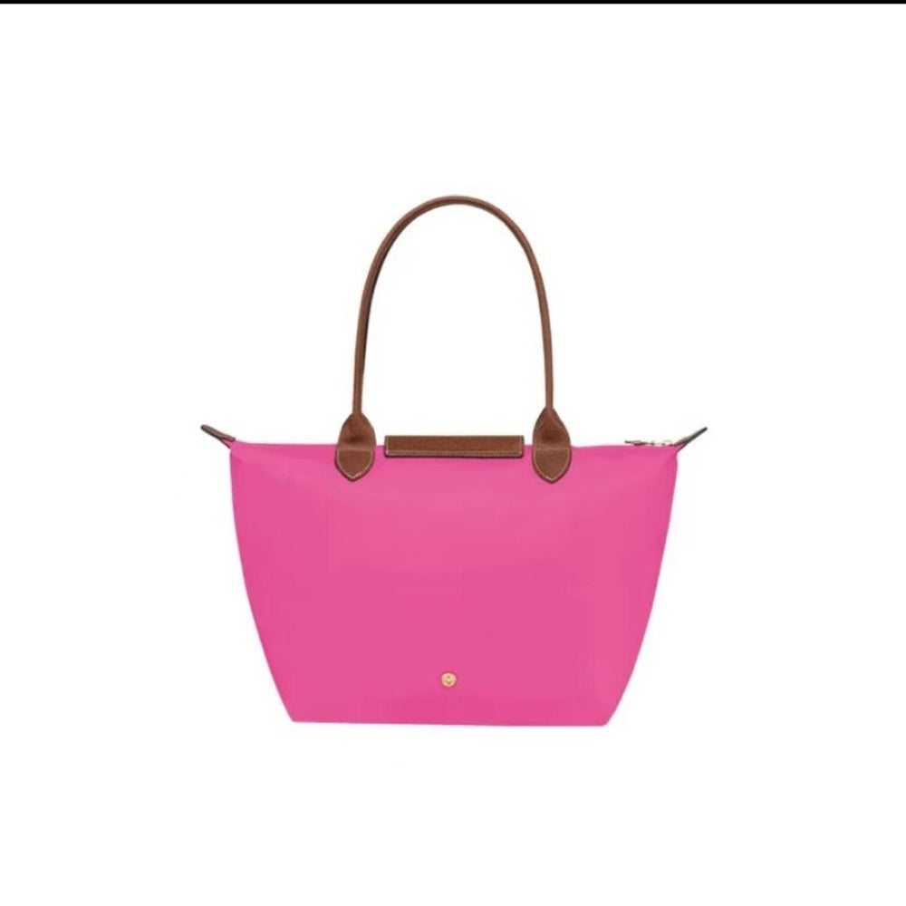 Bolso de mano rosa con detalles marrones