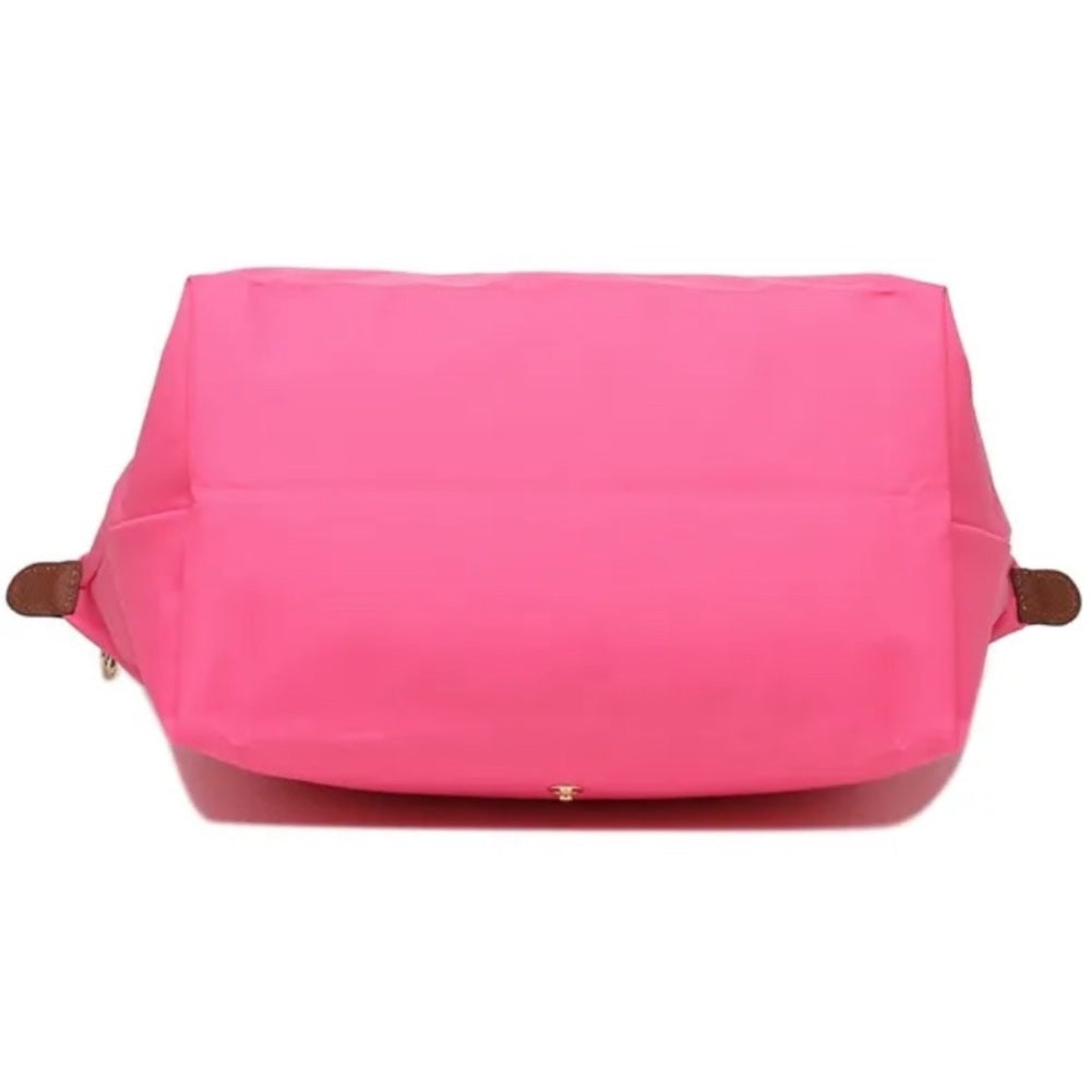 Bolso de mano rosa con detalles marrones