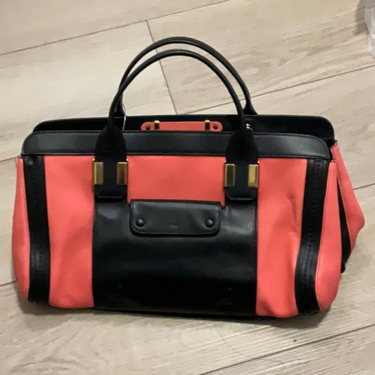 Bolso elegante de mujer en color negro y rosa